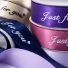 Colorful ribbon rolls are used to decorate the gift box packaging with the words "Just for you" Application Scenario